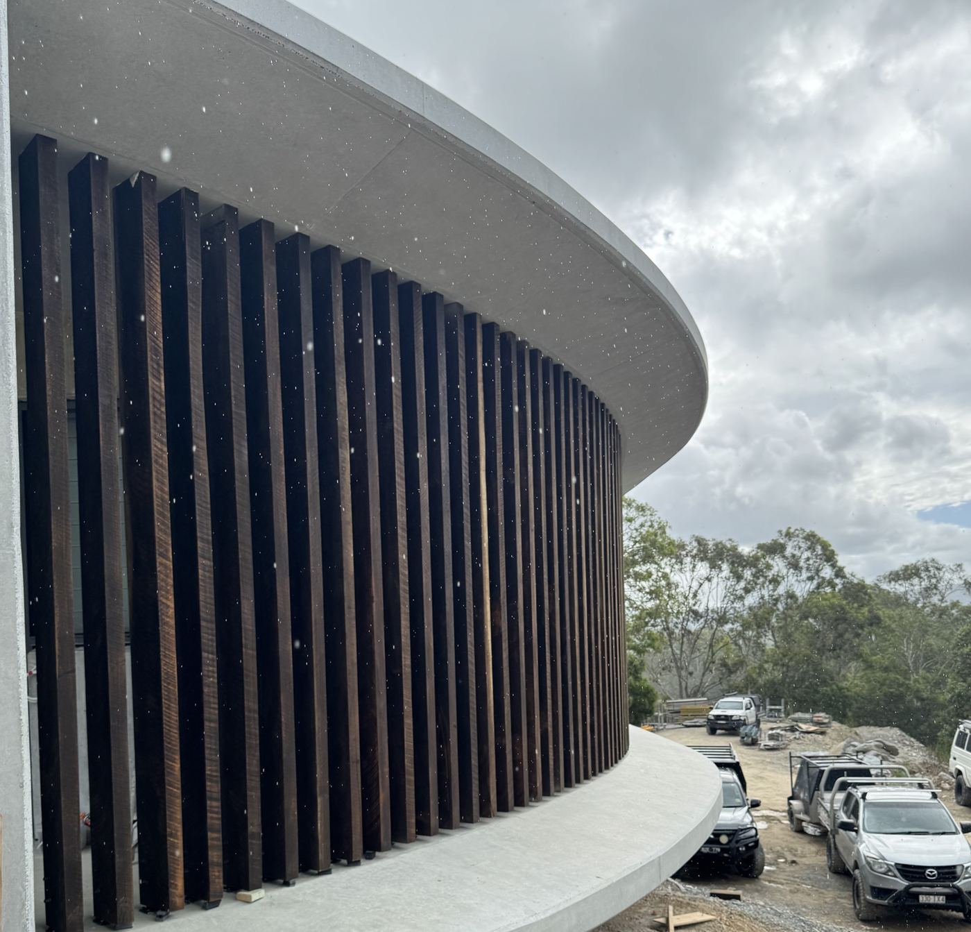 Hardwood battens following a curved concrete slab