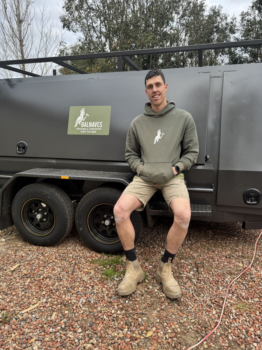 Cohen Balnaves sitting on the Balnaves tool trailer