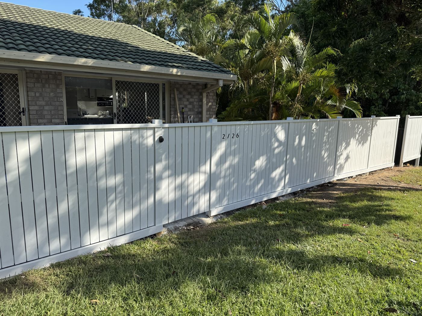 Painted white timber front fence with gate