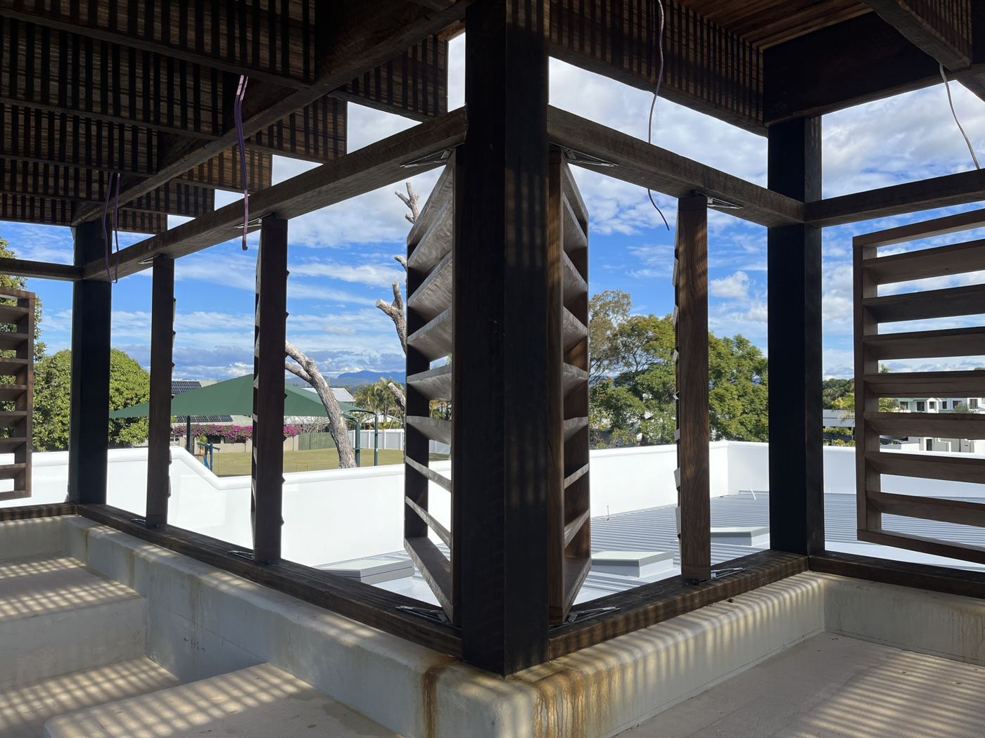 Operable hardwood louvre panels on a rooftop structure