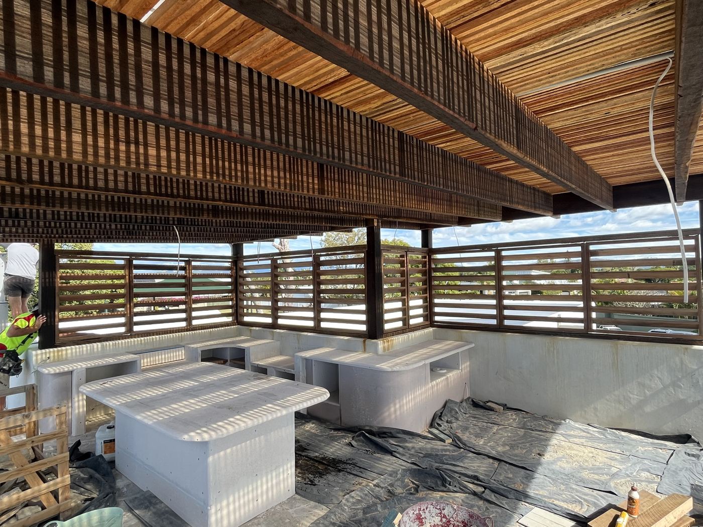 Timber ceiling battens and hardwood louvre screens on a rooftop