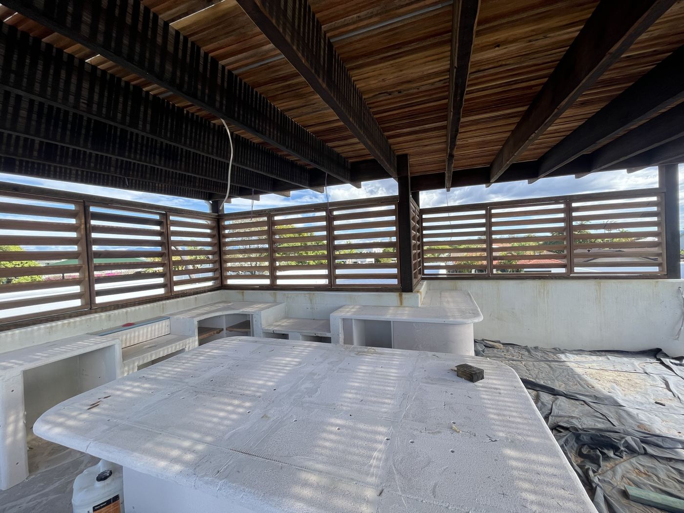 Rooftop pavilion with hardwood louvre screens and timber ceiling